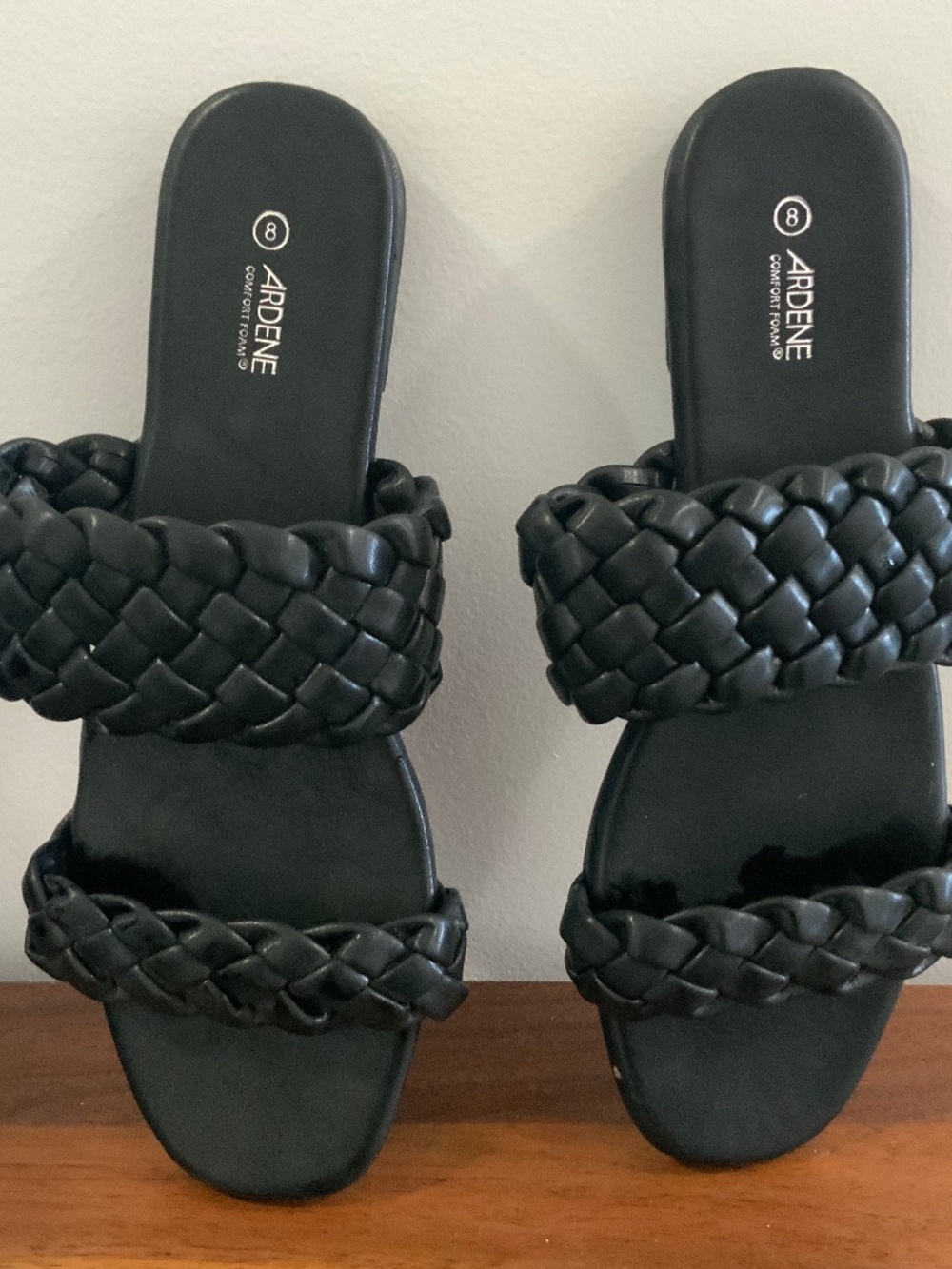 Size 7.5 black braided flat sandals.